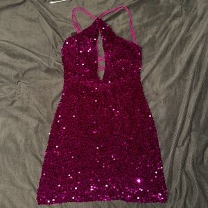 Raspberry colored sequin dress, with an opening in the front